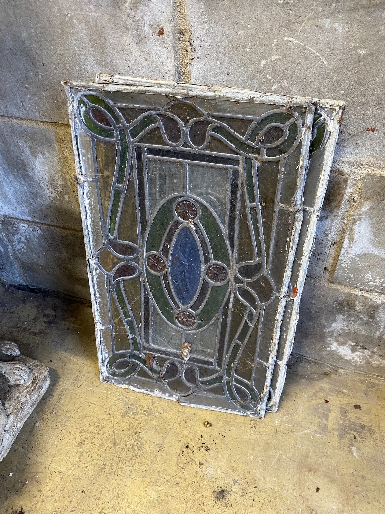Four rectangular stained glass panels, each width 33cm, height 53cm